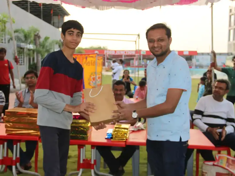 A young winner proudly collecting a prize