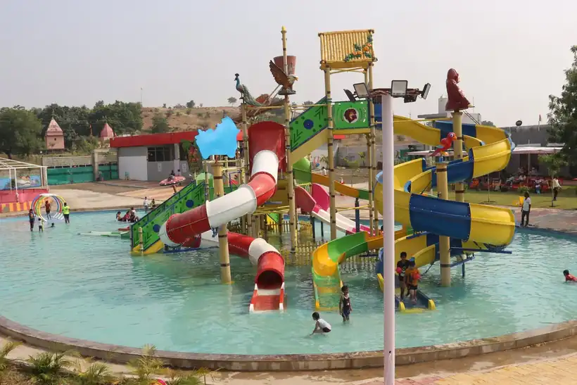 Members racing down the big water slides side by side